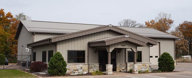 Post-frame contractor building with steel siding, front office space, and rear warehouse area.