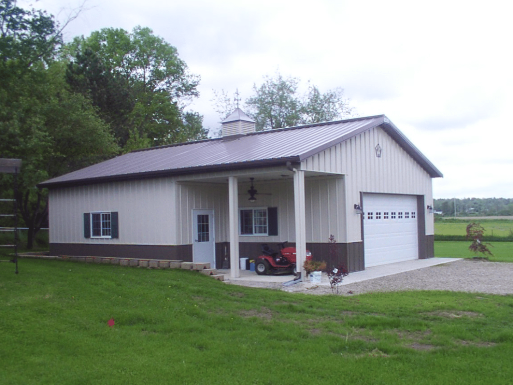 Post-frame building with an inset porch built into the front wall.