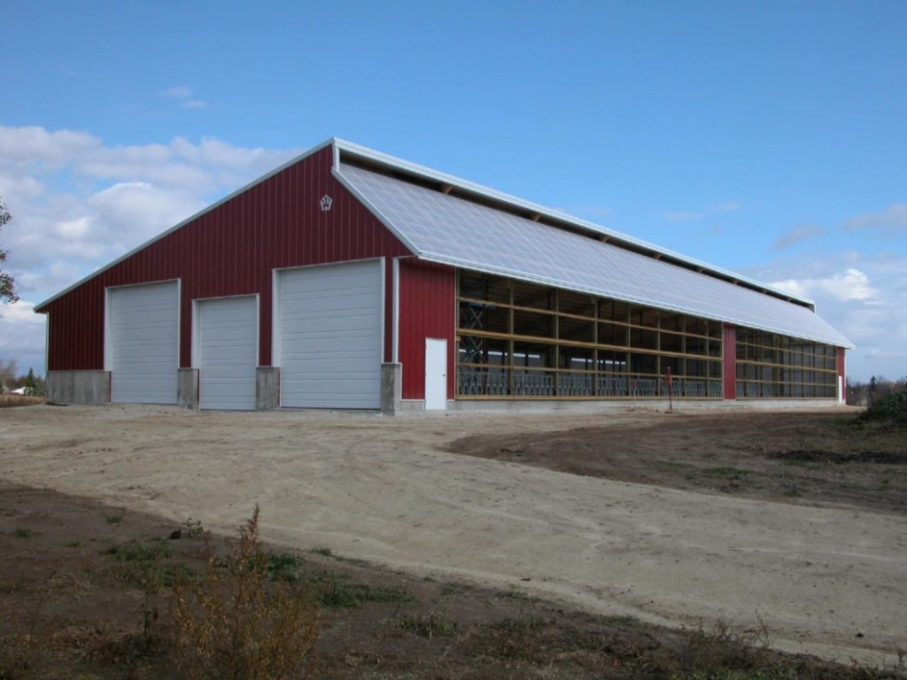 Monoslope pole barn with a single-slope roof and open-front design.