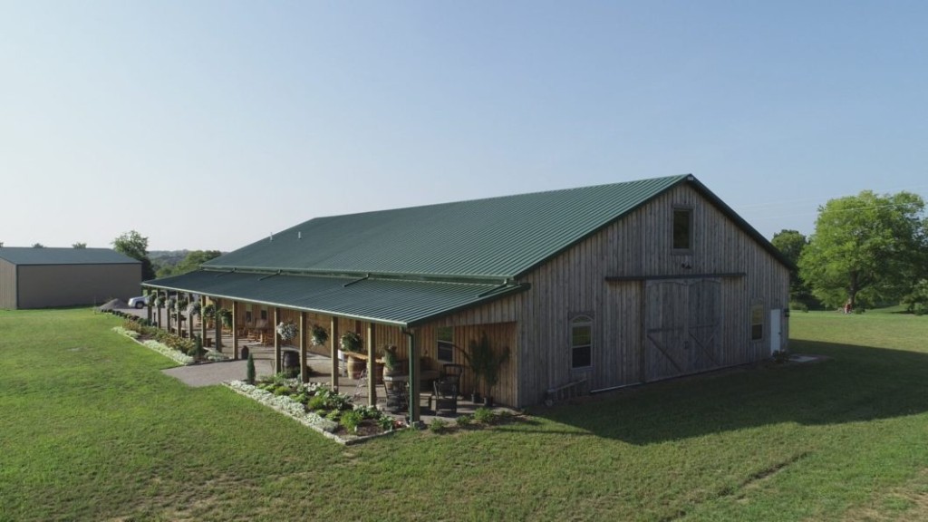 Post-frame building with a step-down porch attached to the sidewall.