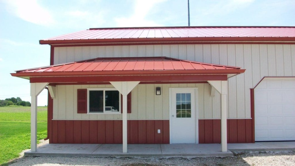 Post-frame building with a standard porch and covered entry area.