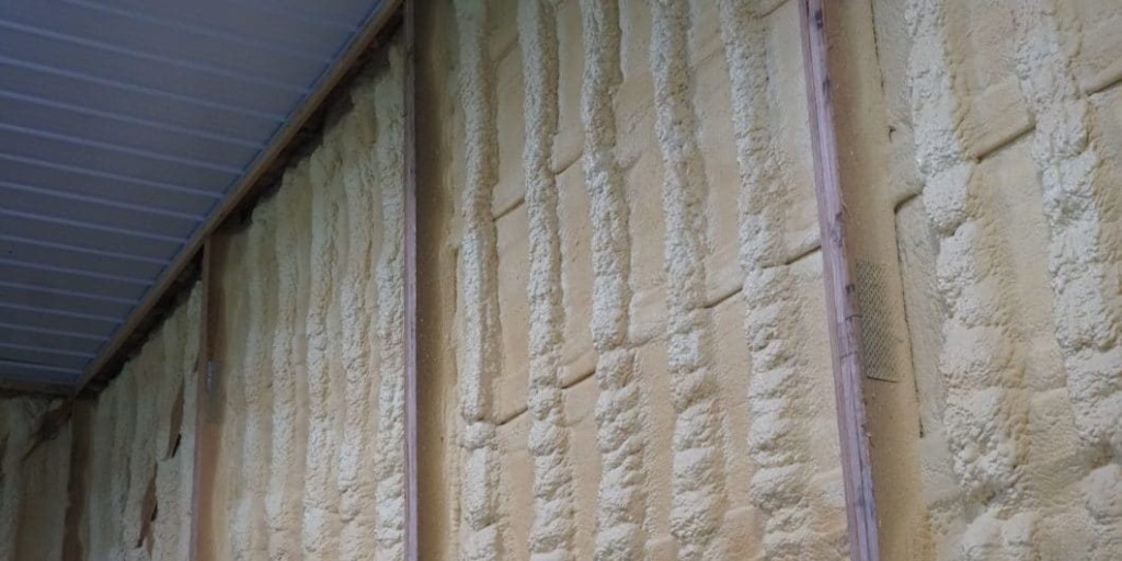 Spray foam insulation applied to the interior walls of a pole barn.