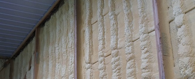 Spray foam insulation applied to the interior walls of a pole barn.