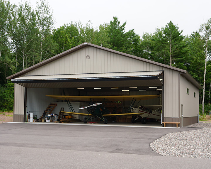 Exterior of Airplane With Hanger Door Open