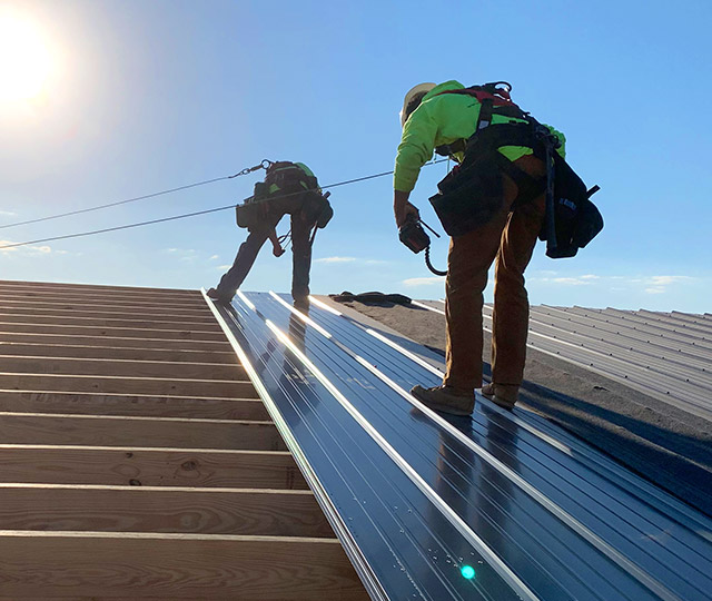 Walters Building Employees Working on Barn Roof
