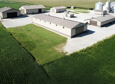 Aerial view of multiple grain farm pole barns used as agricultural storage buildings on a Southern Illinois farm in Enfield, Illinois