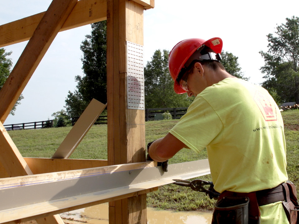 Crew Member Working on Framing