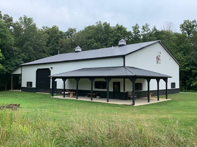 White Post Frame Building used for Machinery Storage
