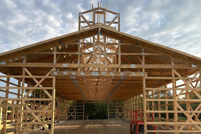 Walters Buildings construction crew framing the monitor roof system for the Baer Powerhouse post-frame building.