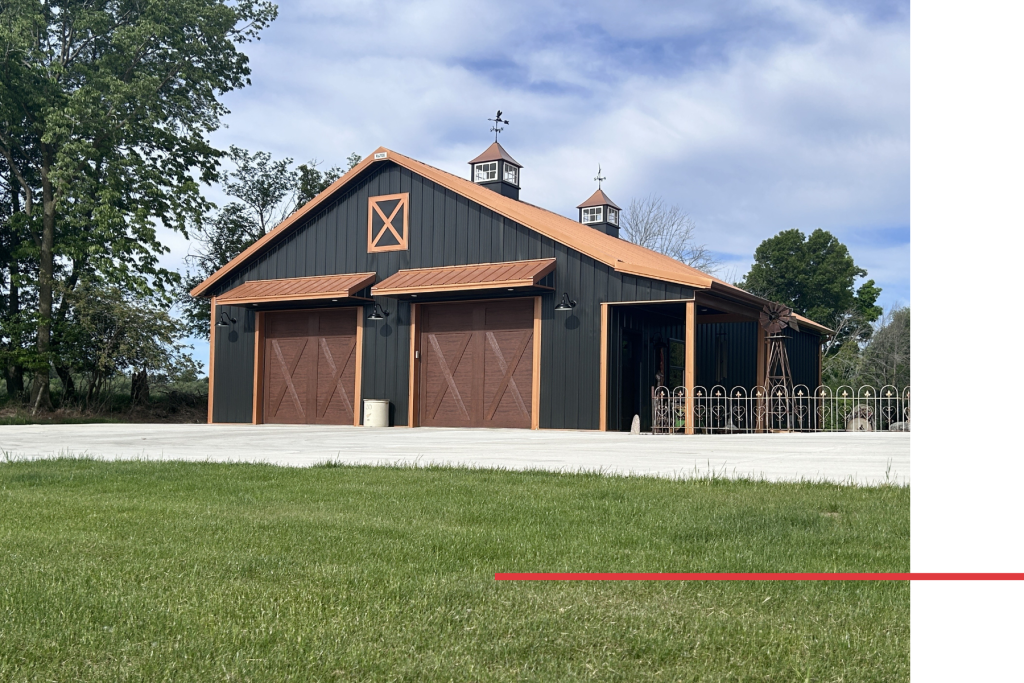 Custom Features on a 36×50 Metal Garage Custom 36x50 metal garage with eyebrow overhangs, faux bale door, cupolas, and side porch by Walters Buildings