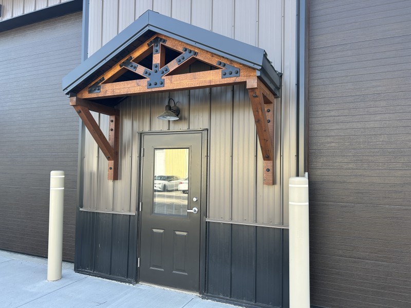 Cedar Truss Entry Canopy Close-up of a commercial flex space entrance with a cedar truss entry canopy