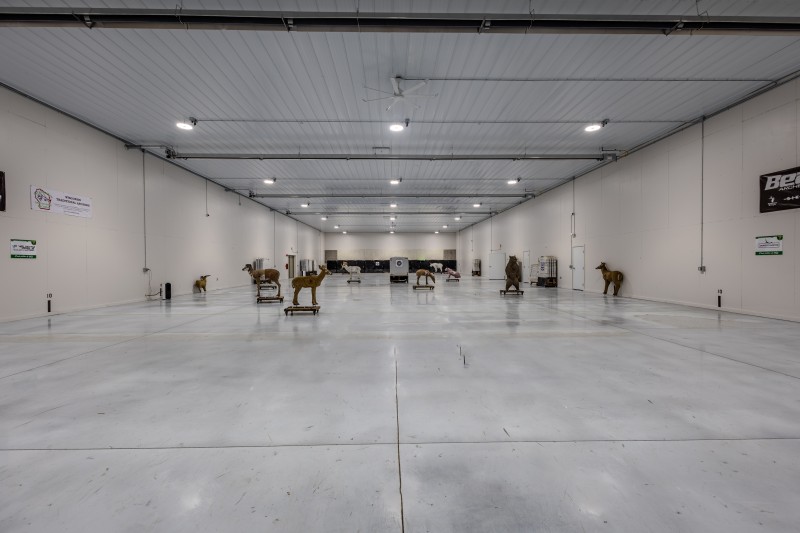 Floor-level view down the 50-yard indoor archery range at Horicon Marsh Archers