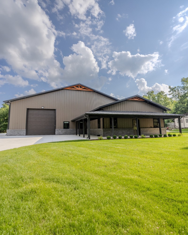 Luxury Car Collector Garage & Private Clubhouse – Delavan, Wisconsin Exterior of a luxury car collector garage and private clubhouse in Delavan, Wisconsin, featuring a covered porch and custom post-frame design.